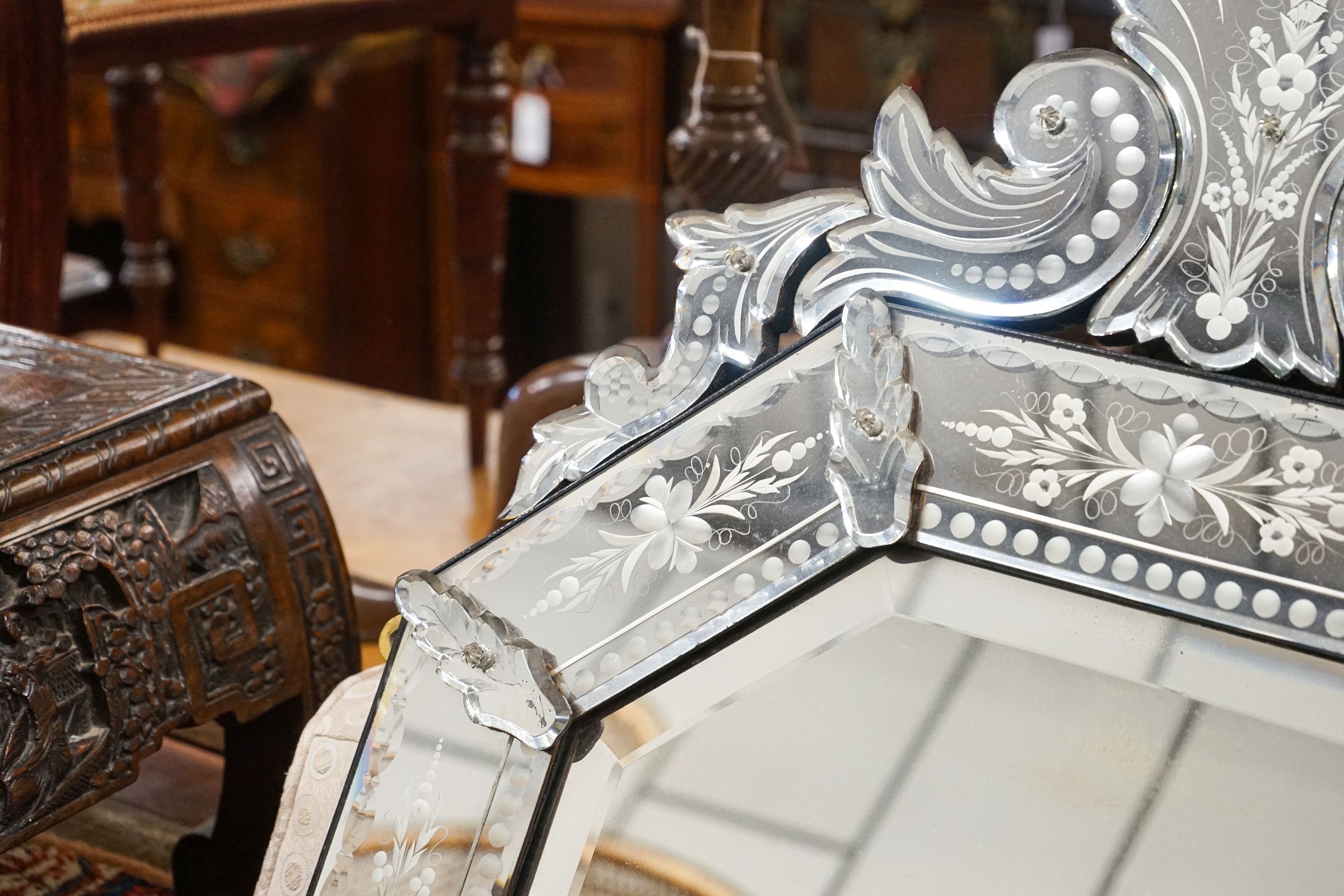 A Venetian style engraved octagonal wall mirror, width 60cm, height 108cm